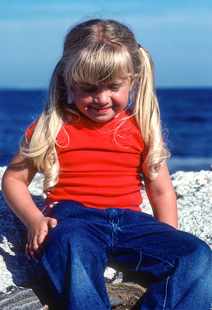 istock Pemaquid - Girl Posing on Granite - 1985 2222460555