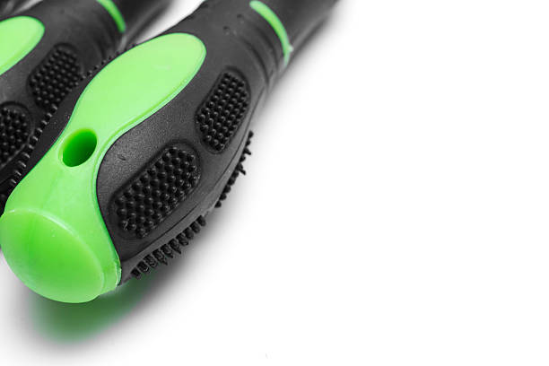istock green plastic screwdriver handles on a white background. 2222460781