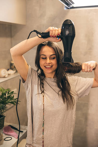 istock Woman Drying Her Hair 2222462744