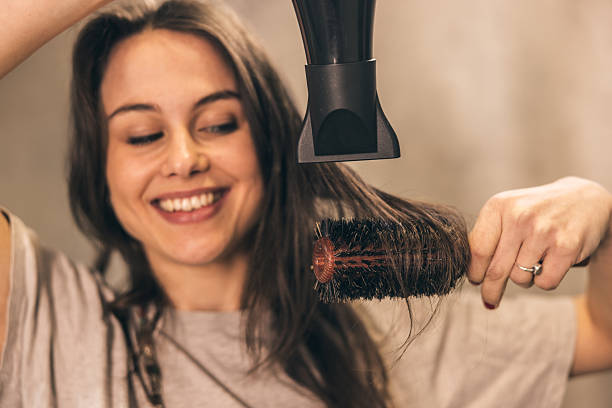 istock Woman Doing Blowout At Home 2222462762