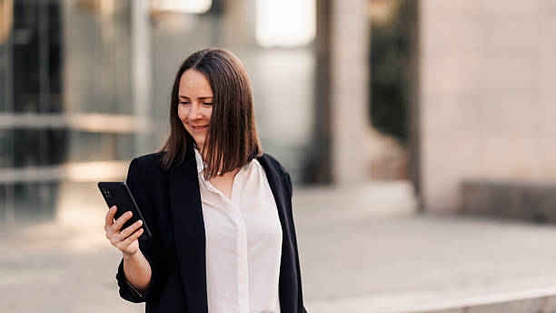 istock Businesswoman using phone and going to job 2222463454
