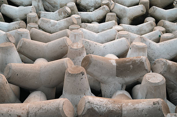Tetrapod structure breakwater, wave dissipating concrete block, prevent erosion caused by weather and longshore drift, coastal seawall, tetrahedral shape
