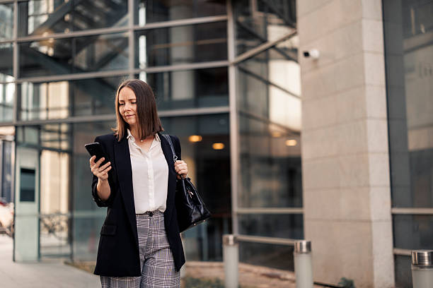istock Businesswoman using phone and going to job 2222466543