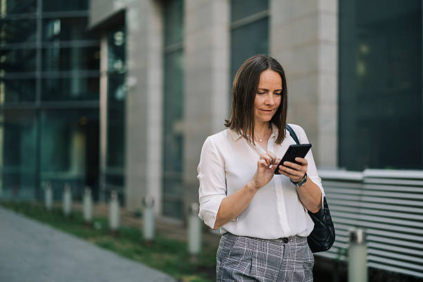 istock Businesswoman using phone and going to job 2222467023