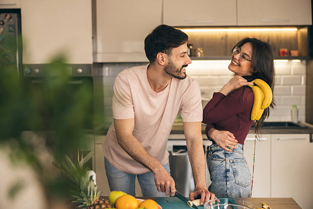 istock Couple Cutting Bananas Together 2222467804