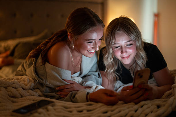 istock Two Friends Sharing a Joyful Moment Together on a Cozy Evening 2222468311