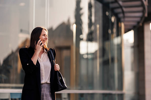 istock Businesswoman using phone and going to job 2222468838
