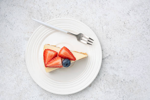 istock Slice of cheesecake topped with fresh berries 2222469863