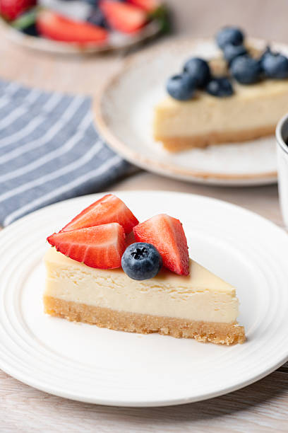 istock Slice of cheesecake topped with fresh berries 2222469867