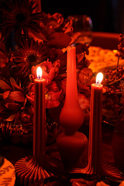 istock three burning candles on the banquet table in the dark. 2222473374