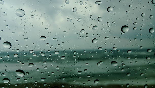 istock Raindrops on a car window with a sea view. 2222474577
