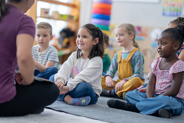 istock Children Engaged in Learning Activities in a Colorful Classroom Environment 2222475740