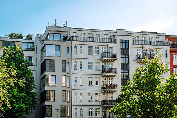Modern Residential Building With Balconies and Green Trees in Berlin, Germany stock photo