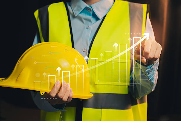 istock Growth concept. Construction Worker with Safety Helmet and Progress Graph Illustrating Growth in Construction Industry Performance 2222477546