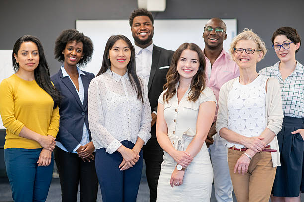istock Diverse Team of Professionals Smiling Together in Office Setting 2222480405