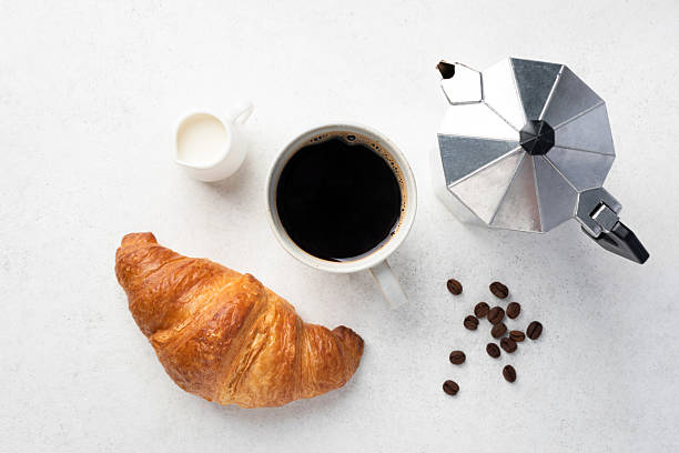 istock Flat lay composition with black coffee, croissant and moka pot 2222480446