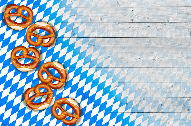 istock Beer Fest background with blue and white tablecloth and pretzel 2222480839