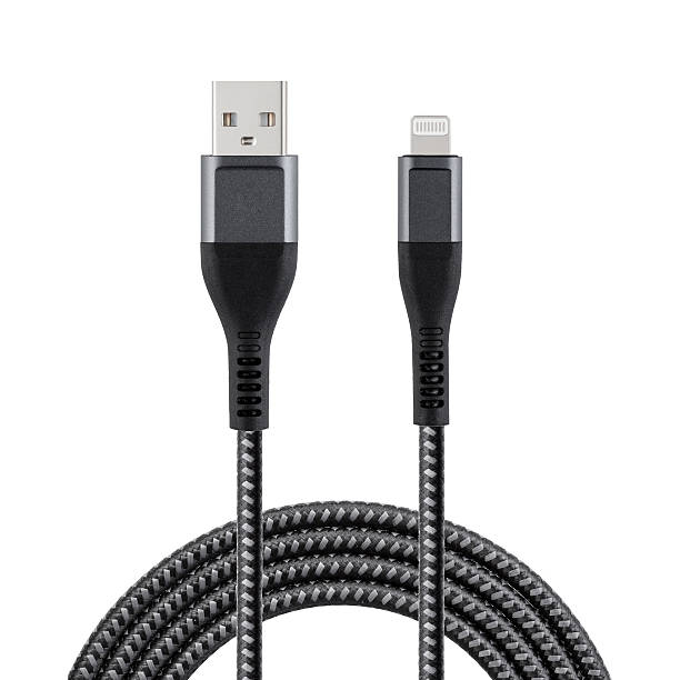 istock Black cable for charging and synchronization with USB and Lightning connectors on a white isolated background 2222482392
