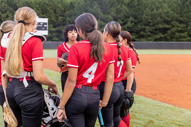 istock High school athletes discuss game during huddle at softball game 2222484304