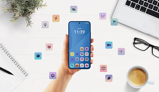 istock Clean smartphone mockup in modern office setup with floating apps suggests versatile business or developer UI tools 2222484482