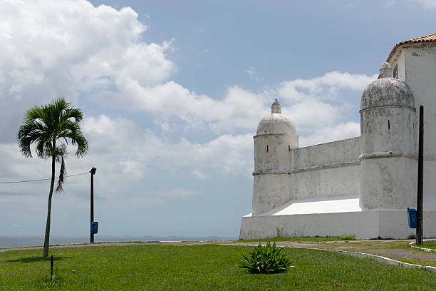Stone path winding through the yellow walls at the entrance of the Fort San José el Alto on a sunny day in Campeche on the Yucatan Peninsula in Mexico