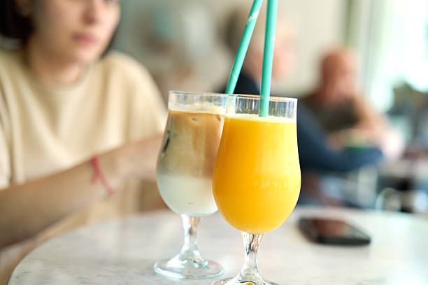 Two persons discussing business projects in a cafe while having coffee. Startup, ideas and brain storm concept