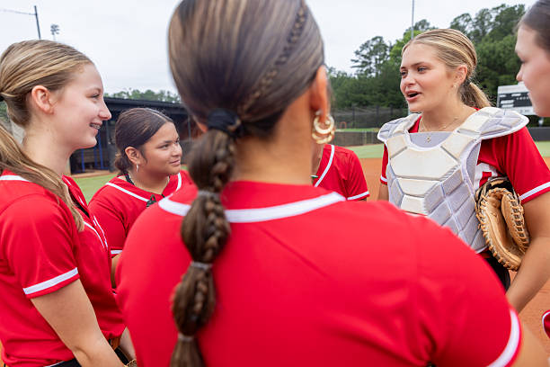 istock High school softball team huddles to discuss play during game 2222496233