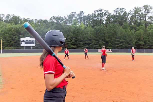 istock High school softball team plays game on rural field 2222496234
