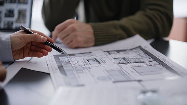 istock Engineer hand pointing plan calculating budget buro closeup. Architect customer 2222498725
