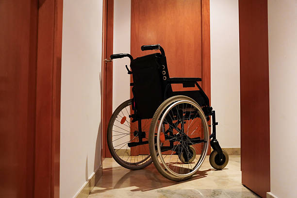 istock Empty wheelchair in home hallway 2222499624