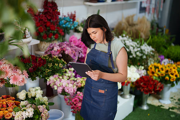istock Florist using digital tablet at the flower shop 2222502258