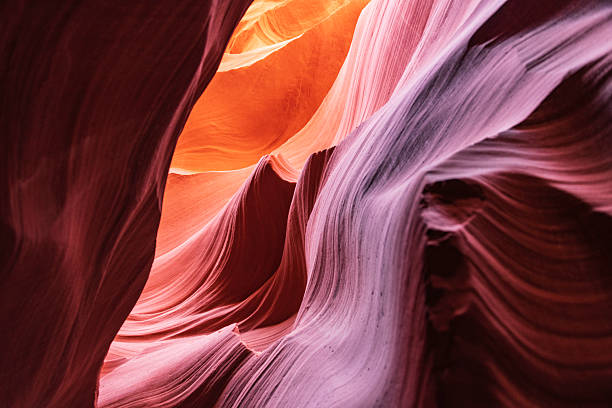 Low angle view from inside the Lower Antelope Slot Canyon in Page with a blue sky, Arizona. USA