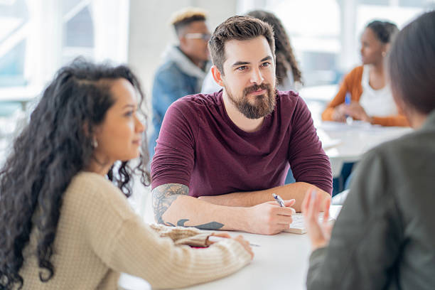 istock Group Discussion and Collaboration Among Young Adults in a Bright Workspace 2222514664