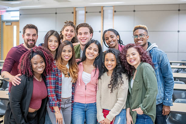 istock Diverse Group of Students Smiling Together in a University Classroom 2222517200