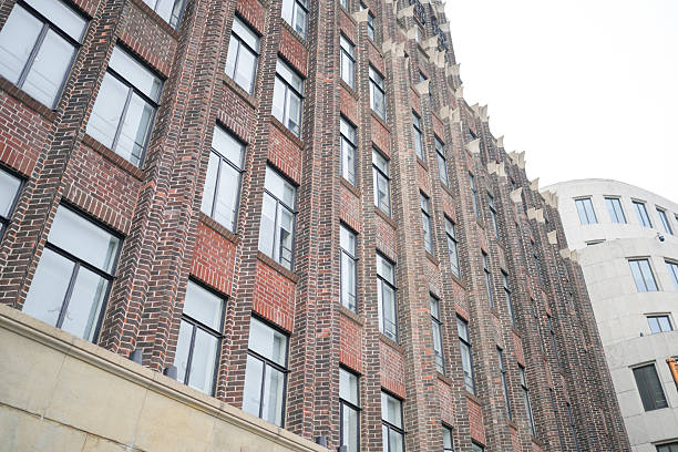 istock On May 31, 2025, a red brick building with colonial-style architecture stands along the Bund, where visitors and locals take photos and enjoy the warm afternoon sunlight in central Shanghai, China. 2222518913