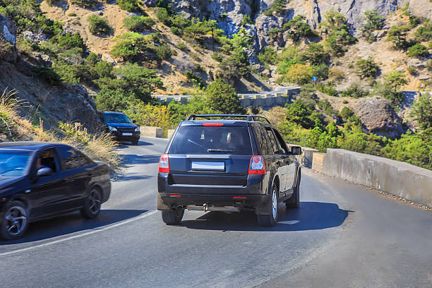 istock Car traffic on a winding road 2222523304