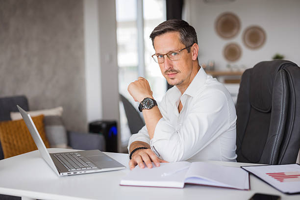 istock Confident businessman working from home office using laptop 2222527625