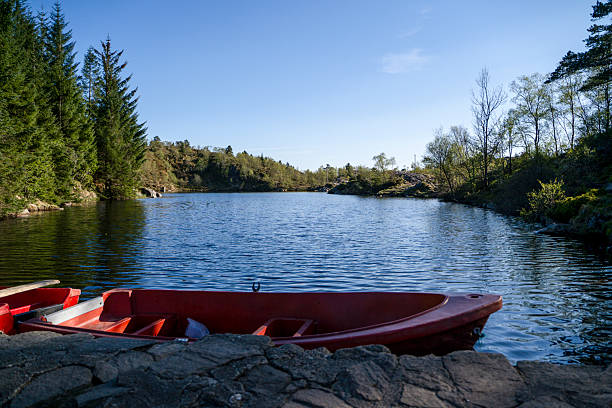 istock Pond and boat in forest 2222528781