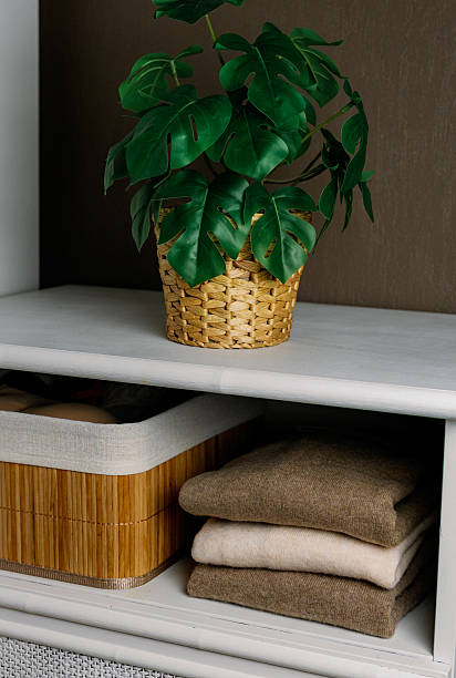 istock A stack of stylish cashmere sweaters on a shelf in a retro closet. 2222531286