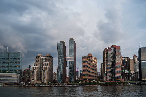 istock Weather system approaching NYC. Cloudy skies loom over Manhattan's distinctive waterfront skyline. 2222531939