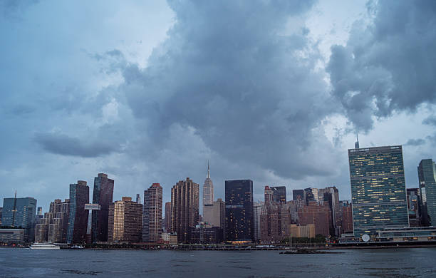 istock Gathering storm clouds above NYC. Dramatic weather system threatens Manhattan skyline. 2222531944