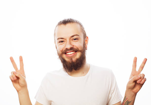 emotional and people concept: young bearded man with good idea sign. Hipster style.