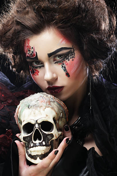istock young beautiful witch holding a skull 2222534244