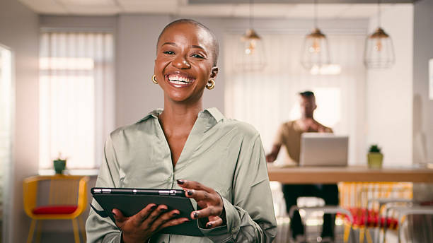 istock Confident Businesswoman Holding a Tablet in a Creative Workspace 2222534319