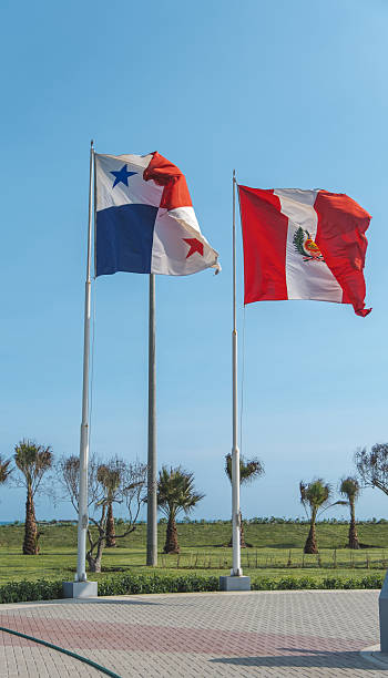 istock Panama and peru flags waving in the wind together 2222535402