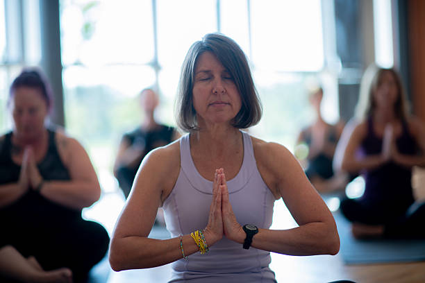 istock Group Yoga Session in a Bright Community Center Setting 2222535880