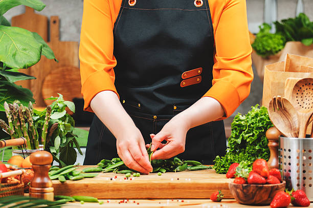 istock Vegan chef prepares fresh vegetables in a stylish kitchen while promoting a healthy lifestyle and mindful cooking 2222536085