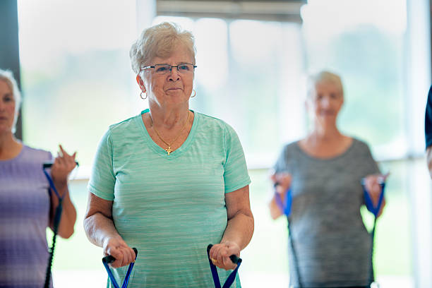 istock Senior Women Participating in a Group Exercise Session at a Community Center 2222536527