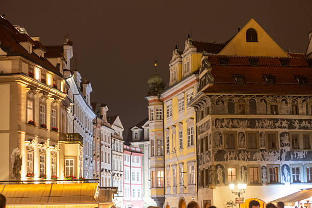 Old town at night with motion blur traffic, intersection, Prague