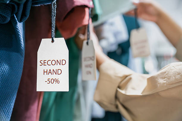 Close-up on clothes at a second hand sale with their discount tag